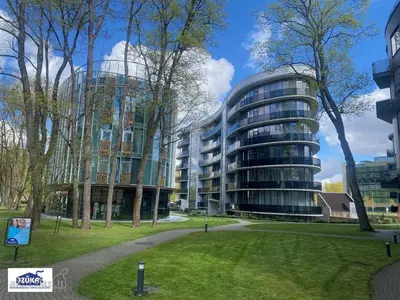 a building with a park in front of it at Drusk Sun in Druskininkai