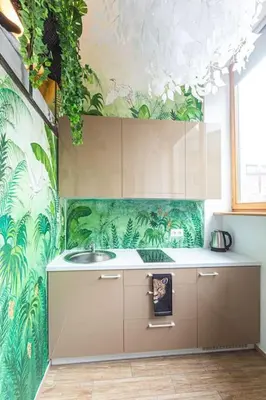 a kitchen with a sink and a wall with plants at Jungle in Vilnius City Center by URBAN RENT in Vilnius