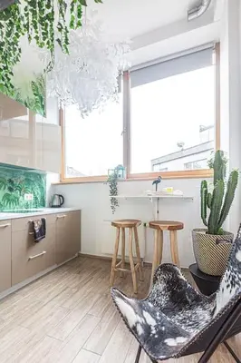 a living room with a chair and a sink at Jungle in Vilnius City Center by URBAN RENT in Vilnius
