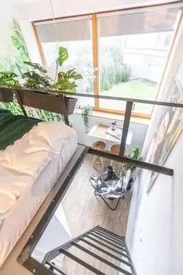 a room with a couch and a glass table at Jungle in Vilnius City Center by URBAN RENT in Vilnius