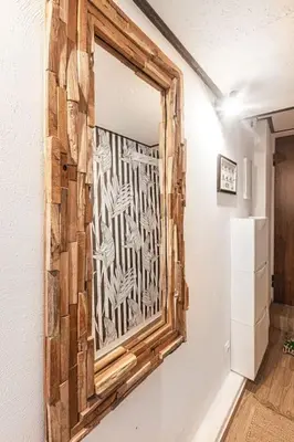 a mirror on a wall in a room at Jungle in Vilnius City Center by URBAN RENT in Vilnius