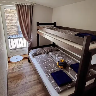 a bedroom with a bunk bed with a toy on it at Sabos Rezidencija Private Countryside Villa near Vilnius in Dzenkuniskes