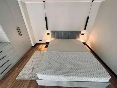 a bedroom with a large bed in a room at Sunny loft 24x7 x free parking x close to old town by H&H in Vilnius