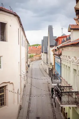 an empty street in a city with buildings at Cosy and bright Saint Ignoto Apartment by Reside Baltic in Vilnius