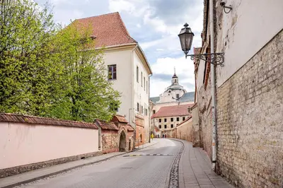 an empty street in an old town with buildings at Cosy and bright Saint Ignoto Apartment by Reside Baltic in Vilnius