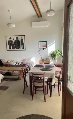 a living room with a table and chairs and a couch at Milky Way House in Karvys