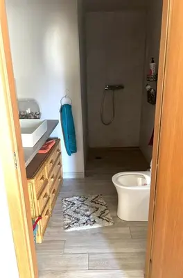 a bathroom with a toilet and a sink and a tub at Milky Way House in Karvys