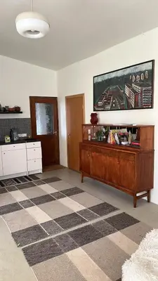a living room with a checkered floor at Milky Way House in Karvys