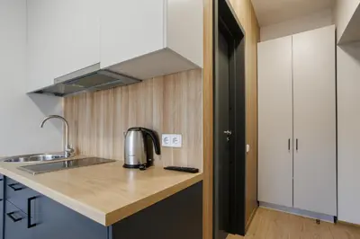 a kitchen with a sink and a counter top at Restart in Kaunas
