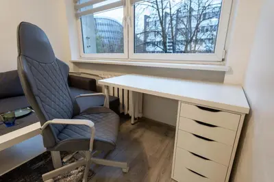 an office with a desk and a chair and a window at Urban Studio Vilnius in Vilnius