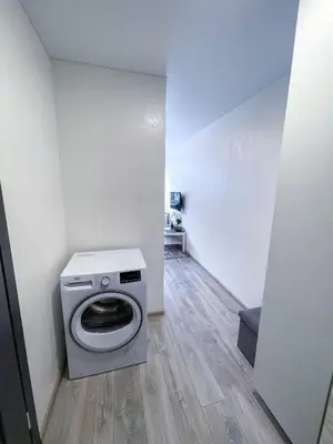 a laundry room with a washing machine in it at Urban Studio Vilnius in Vilnius