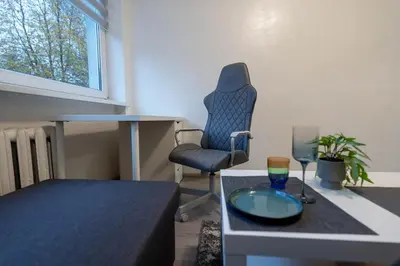 a room with a desk and a chair and a table at Urban Studio Vilnius in Vilnius