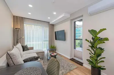 a living room with a couch and a table at Birstonas Rent in Birštonas