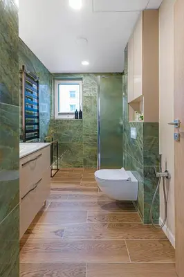 a bathroom with a shower and a toilet and a sink at Birstonas Rent in Birštonas