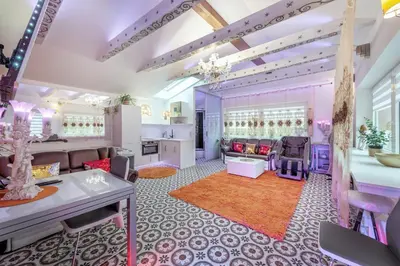 a salon with purple and pink furniture at Villa SPA in Vilnius