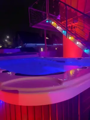 a swimming pool with red and blue lights at Villa SPA in Vilnius