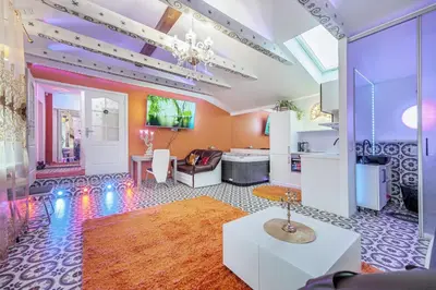 a living room with a couch and a table at Villa SPA in Vilnius