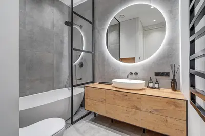 a bathroom with a sink and a mirror at Boutique apartment in Old Town in Vilnius