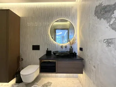 a bathroom with a toilet and a sink and a mirror at Apartment near Hospital Kaunas Clinics in Kaunas