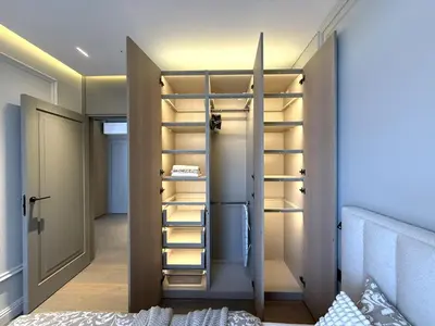 a walk in closet with a door and shelves at Apartment near Hospital Kaunas Clinics in Kaunas