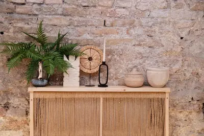 a table with plants and vases on top of it at Aura Spa in Vilnius