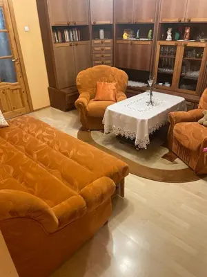 a living room with a couch and chairs and a table at Ground floor apartment close to city centre and tourist attractions in Druskininkai