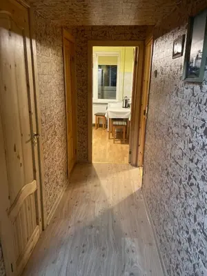 an empty hallway of a house with a table and chairs at Ground floor apartment close to city centre and tourist attractions in Druskininkai
