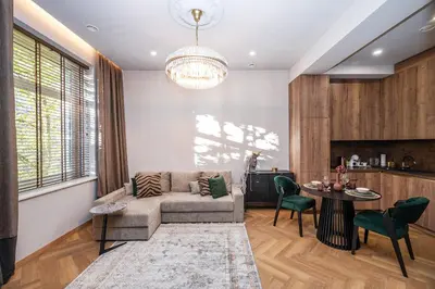 a living room with a couch and a table at Poppy Apartments in Vilnius