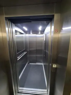 an elevator in a building with its door open at Riverside Retreat Near City in VNO