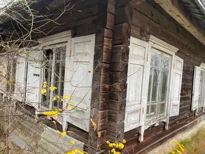 an old house with white doors and windows at Daffaydaffay in Kruminiai