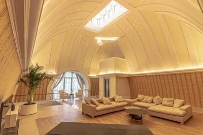 a living room with two couches and a ceiling at Luxury & Best location in Vilnius