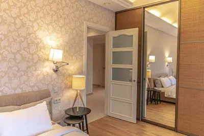 a room with a bed and a mirror and a bedroom at Luxury & Best location in Vilnius