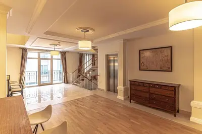 a living room with a table and a dresser at Luxury & Best location in Vilnius