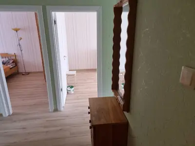 a room with a mirror on the wall and a table at Kaunas 174 in Kaunas
