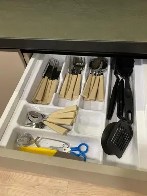 a drawer filled with lots of kitchen utensils at Kaja Home in Šiauliai