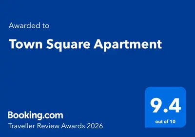 a blue square with the textouched to town square appointment at Town Square Apartment in Panevėžys