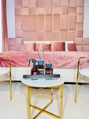 a living room with a couch and a coffee table at IN ROOM Old town Kaunas in Kaunas