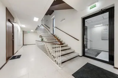 a hallway with a staircase in a building at Cozy 55m2 Zverynas Retreat with Lodge in Vilnius