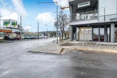 an empty street in front of a building at Cozy 55m2 Zverynas Retreat with Lodge in Vilnius