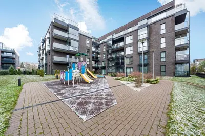 a playground with a slide in front of a building at Cozy 55m2 Zverynas Retreat with Lodge in Vilnius