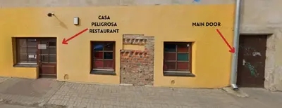 two doors on a building with two arrows on it at EIM apartment in Vilnius