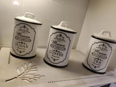 three bottles of coffee sitting on a table at Pilies VIP apartaments in Vilnius