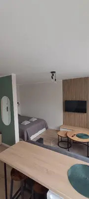 a model of a bedroom with a bed and a table at SKY Studio flat in Panevėžys