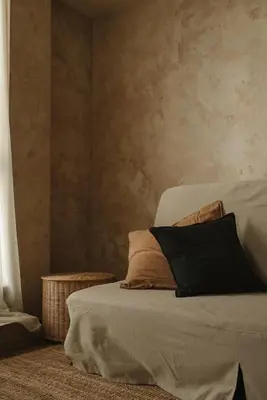 a bed with two pillows on it in a room at Wabi-sabi apartamentai in Alytus