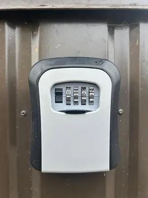 a soap dispenser is attached to a wall at Charming Apartment with Private Yard in Marijampolė
