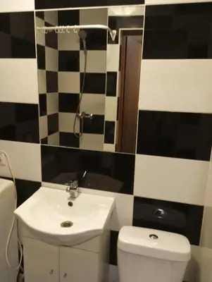 a bathroom with a sink and a toilet at Butas centre šalia pėsčiųjų bulvaro in Šiauliai