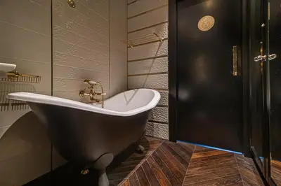 a bath tub in a bathroom with a shower at Basanaviciaus 9 in Vilnius