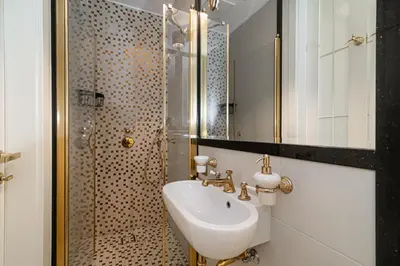 a bathroom with a sink and a shower at Basanaviciaus 9 in Vilnius