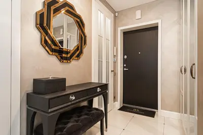 a bathroom with a black vanity and a mirror at Basanaviciaus 9 in Vilnius