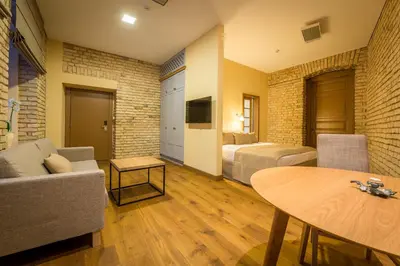 a living room with a couch and a table at New Town Home 3 in Vilnius
